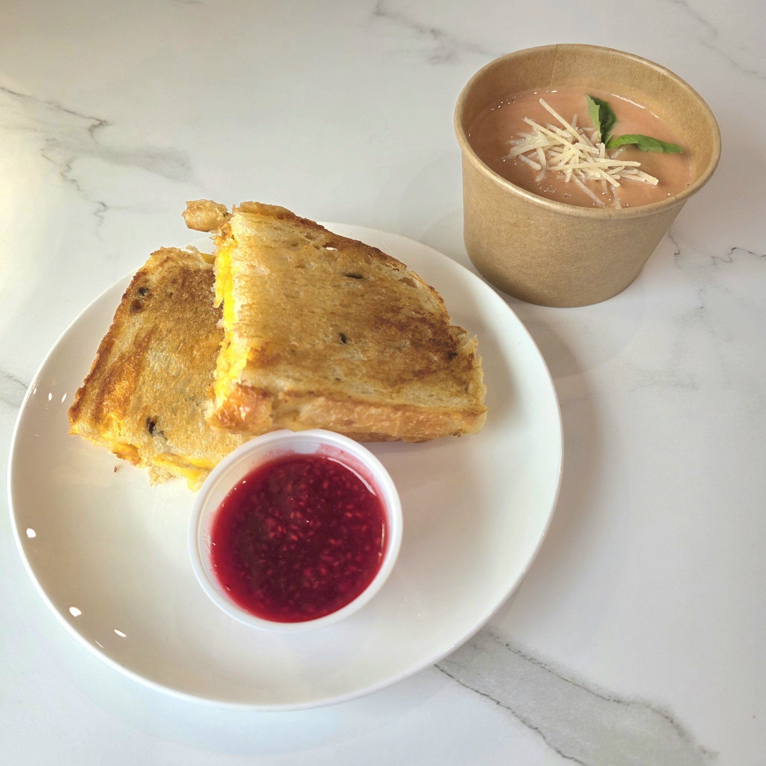 Fiery Griddled Cheese Sandwich with Raspberry Coulis and Tomato Bisque Soup